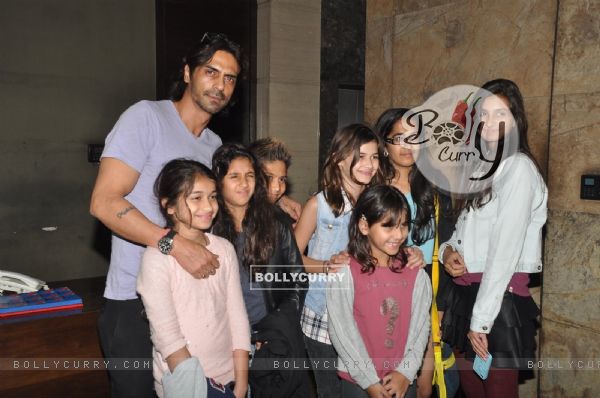 Arjun Rampal poses with children at the Special Screening of Roy