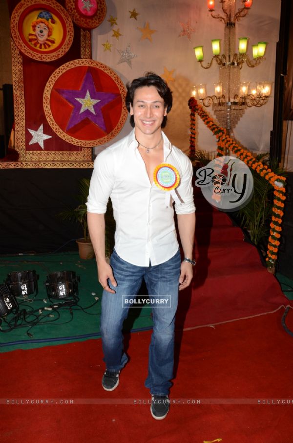 Tiger Shroff poses for the media at the Annual Day of Children's Welfare Centre High School
