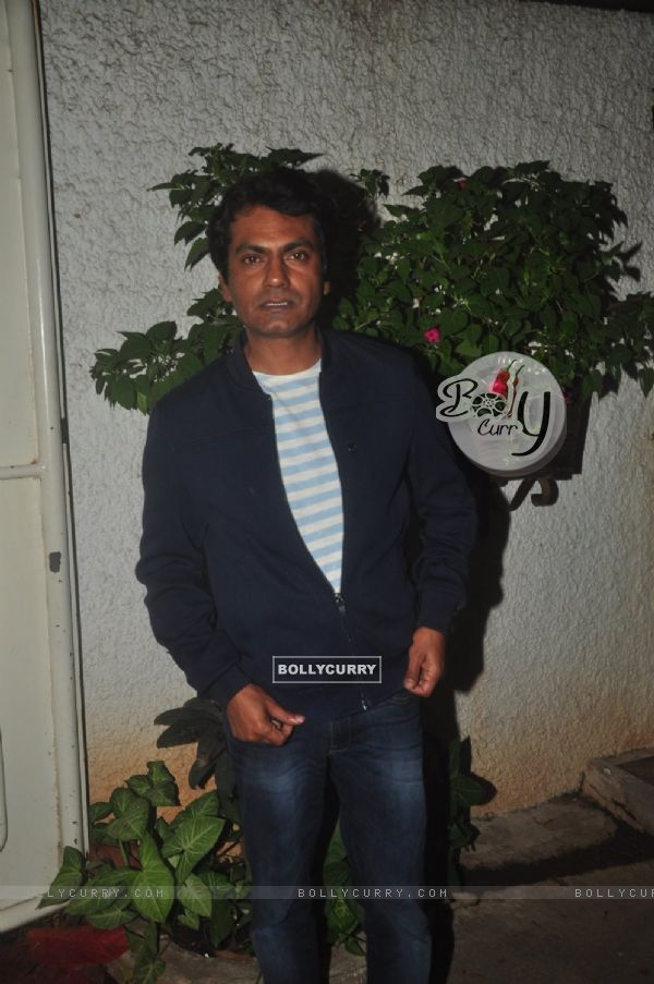 Nawazuddin Siddiqui poses for the media at the Special Screening of Badlapur