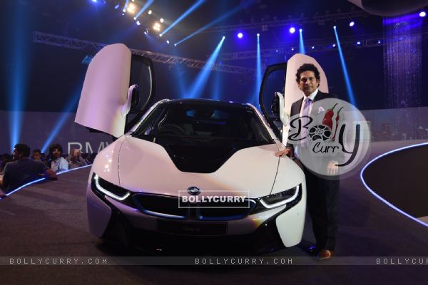 Sachin Tendulkar poses alongside the new BMW i8 at the Launch
