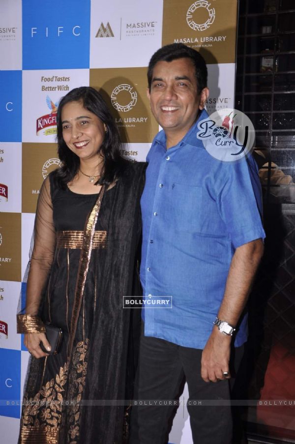 Sanjeev Kapoor poses with wife at Masala Library Launch