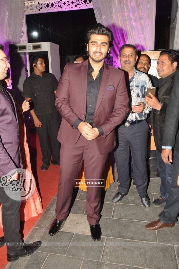 Arjun Kapoor poses for the media at Tulsi Kumar's Wedding Reception