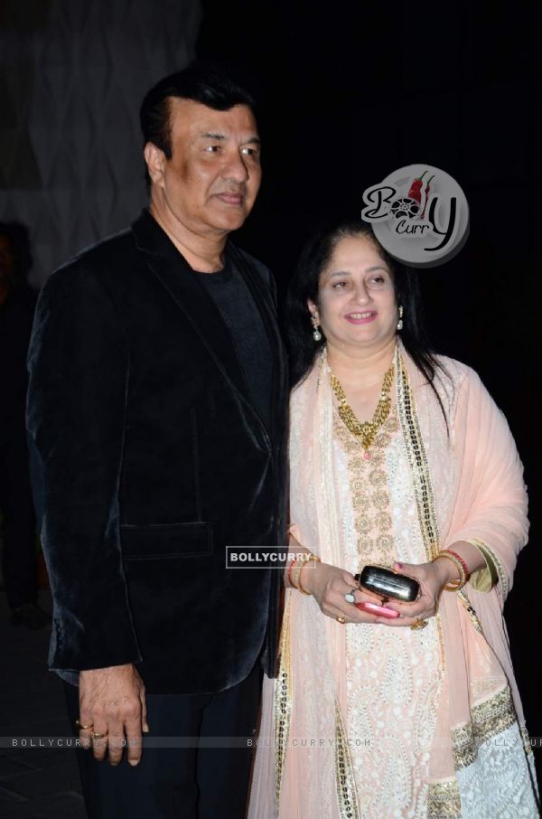Anu Malik poses with wife at Tulsi Kumar's Wedding Reception