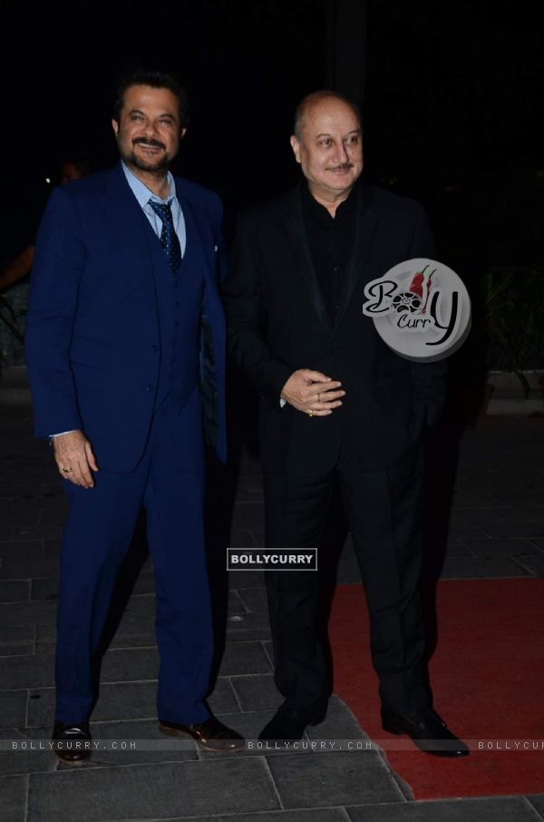 Anil Kapoor and Anupam Kher pose for the media at Tulsi Kumar's Wedding Reception