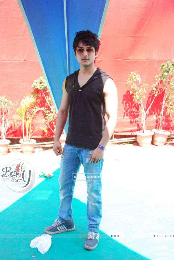 Rohan Mehra poses for the media at Holi Celebrations