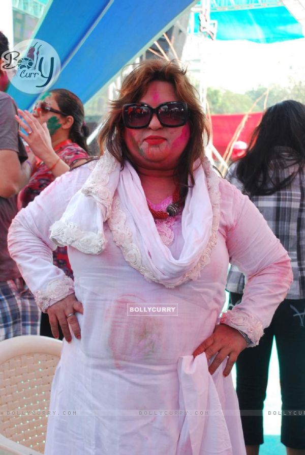 Dolly Bindra poses for the media at Holi Celebrations