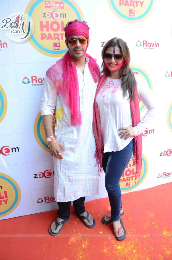 Deepshikha Nagpal and Kaishav Arora pose for the media at Zoom Holi Bash
