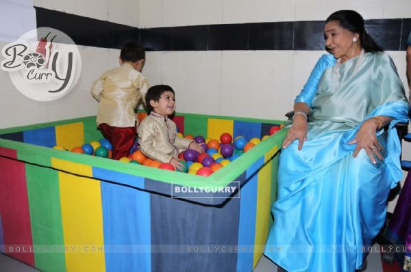 Asha Bhosle plays with the kids at the Inauguration