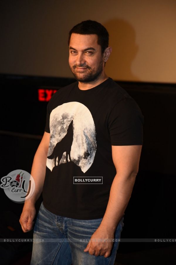 Aamir Khan poses for the media at the DVD Launch of P.K.