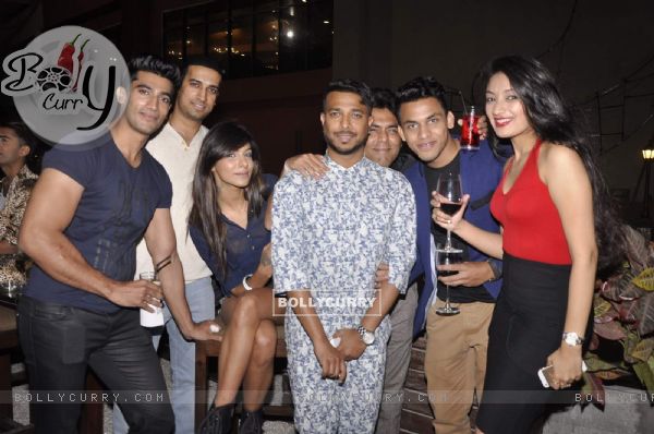 Ken Ferns poses with friends at his 2015 Collection Bash