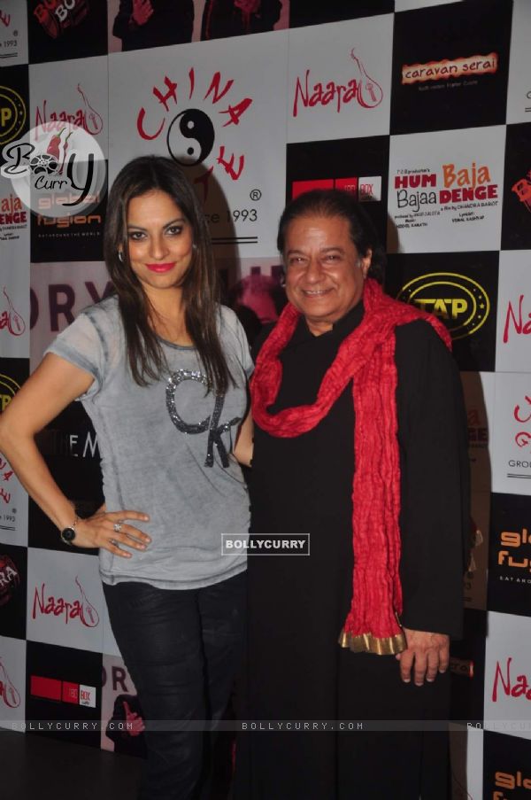 Anup Jalota poses with a friend at a Musical Event