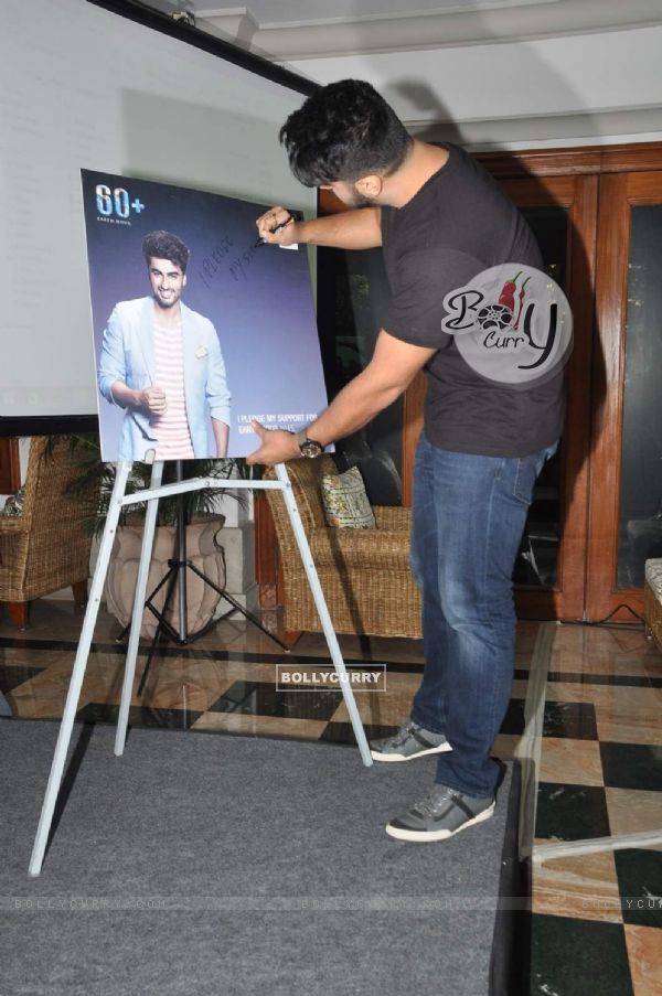 Arjun Kapoor signs his autograph at Earth Hour Press Meet