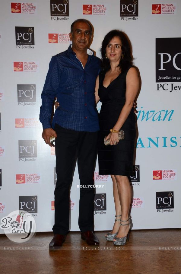 Milan Luthria poses with wife at the Red Carpet of 'Mijwan-The Legacy'
