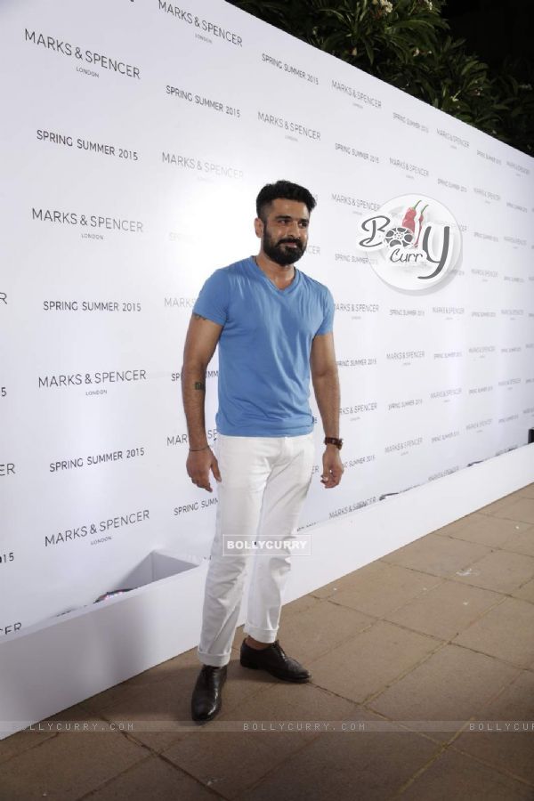 Eijaz Khan poses for the media at Marks & Spencers Spring/Summer 2015 Collection Launch