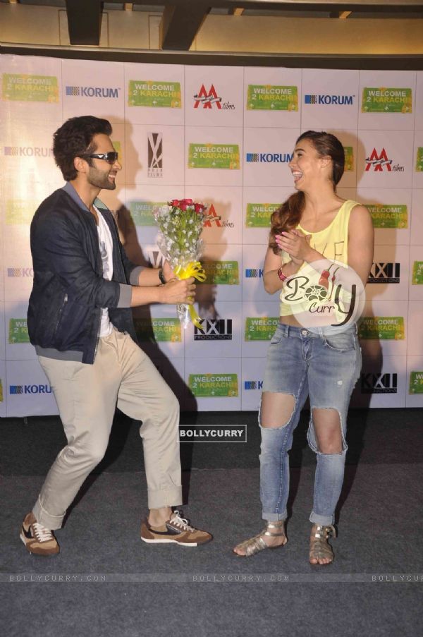 Jackky Bhagnani giving Lauren Gottlieb a bouquet of flowers at the Promotions of Welcome To Karachi (363993)