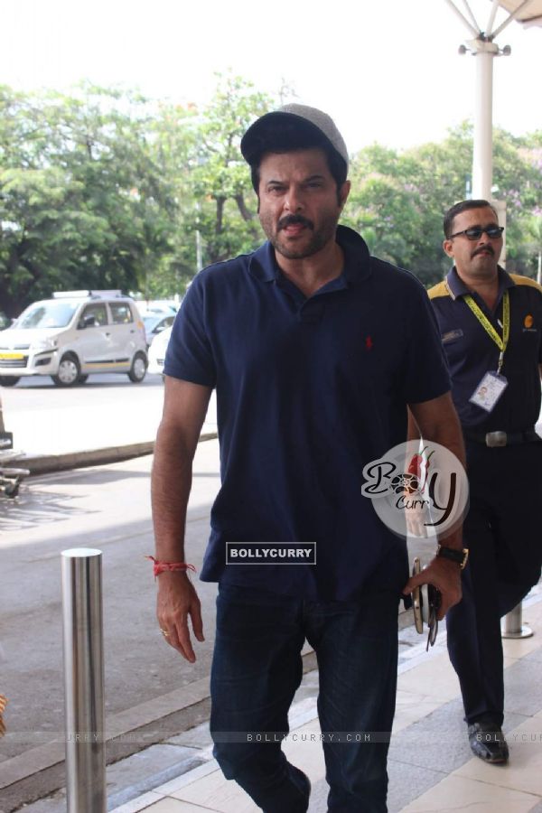 Anil Kapoor poses for the media at Airport