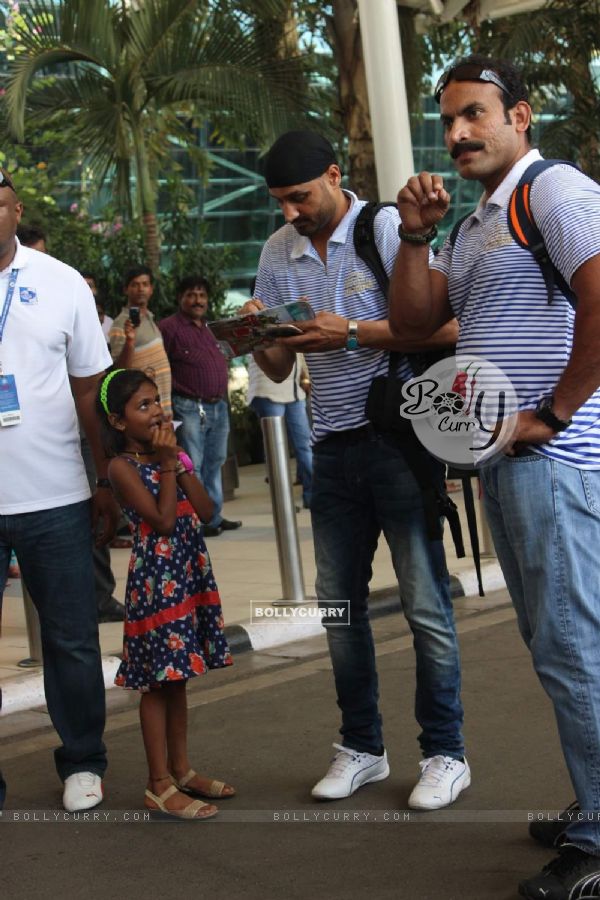 Harbhajan Singh Autographs for a Kid at Airport