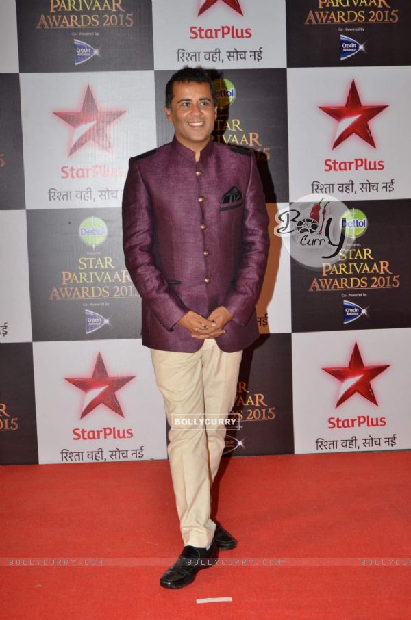 Chetan Bhagat poses for the media at Star Parivaar Awards 2015