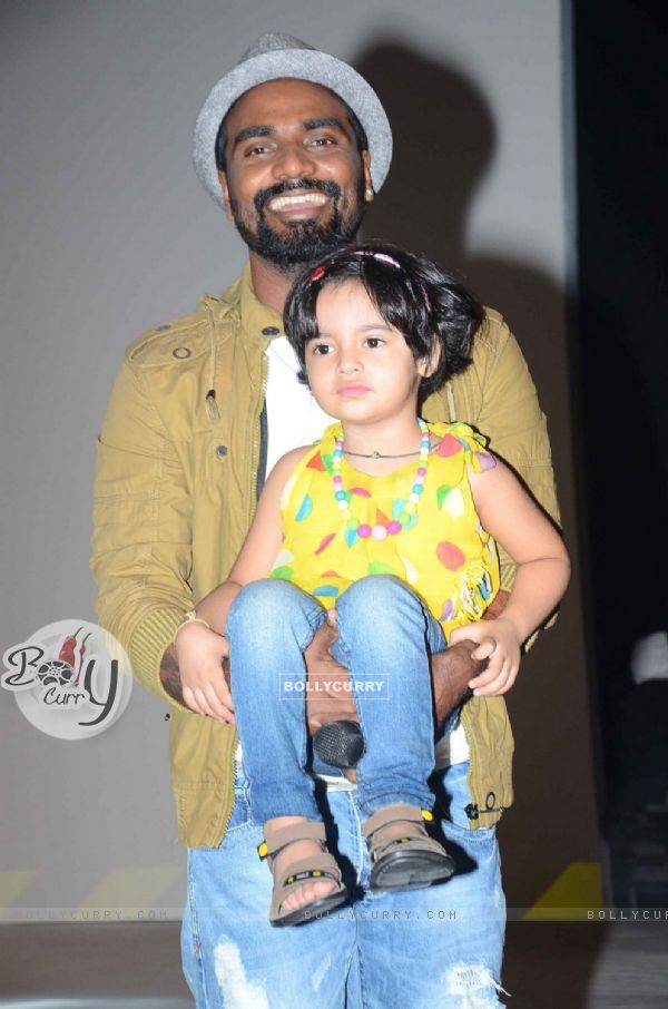 Remo Dsouza was snapped holding a small girl during the ABCD 2 Pond's Men Promotions