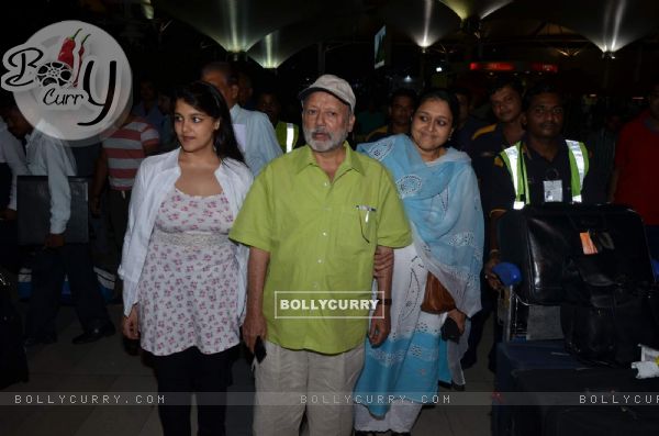 Pankaj Kapoor and Supriya Pathak pose for the media at Airport