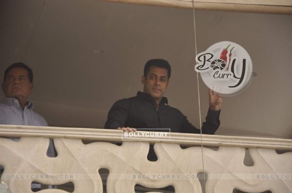 Salman Khan waves to his fans from his balcony during the occassion of Eid