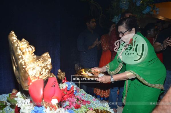 Helen Offers Prayer to Ganesh at Home
