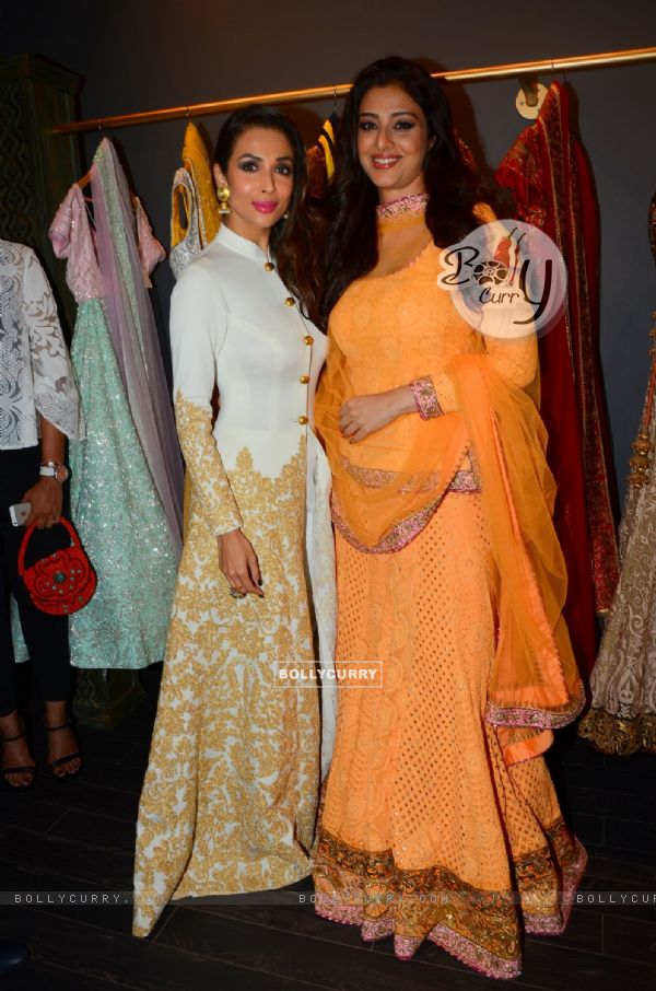 Malaika Arora Khan and Tabu pose for the media at the Launch of Mayyur Girotra Store in Dubai