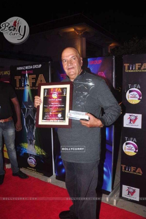 Prem Chopra poses with his awards at TIFA Awards