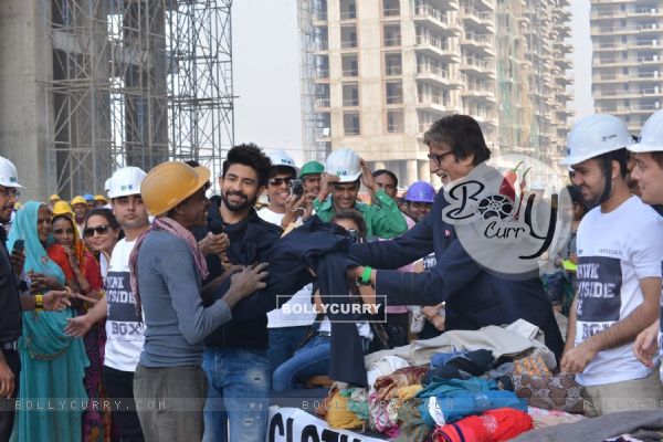 Big B Donates Clothes and interacts with workers!