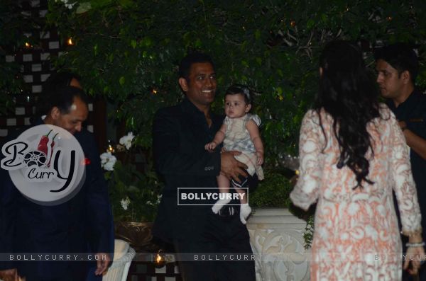 Dhoni was snapped holding baby daughter Ziva at Mukesh and Nita Ambani's Bash