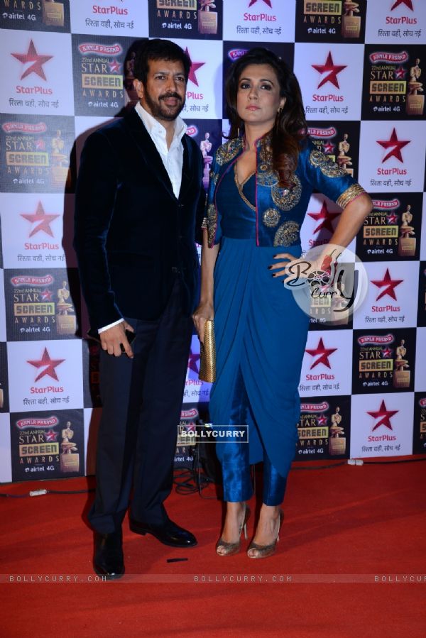 Kabir Khan poses with wife Mini Mathur at the 22nd Annual Star Screen Awards