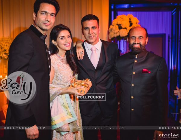 Akshay Kumar Poses with the Newly Married Couple Asin & Rahul Sharma at their Wedding Reception