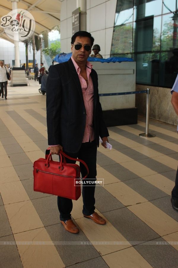 Madhur Bhandarkar poses for the media at Airport