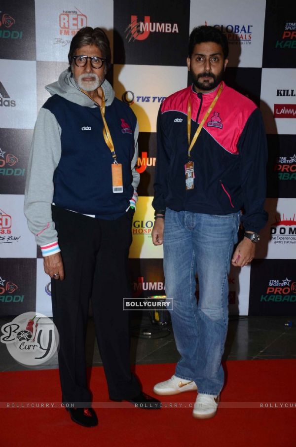 Amitabh Bachchan and Abhishek Bachchan pose for the media at Pro Kabaddi Match
