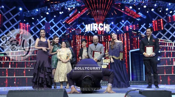 Udit Narayan pays respect to the stage at Mirchi Music Awards 2016