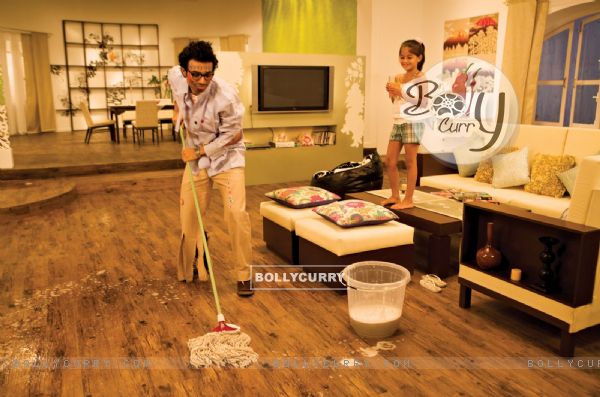 Uday Chopra cleaning the floor