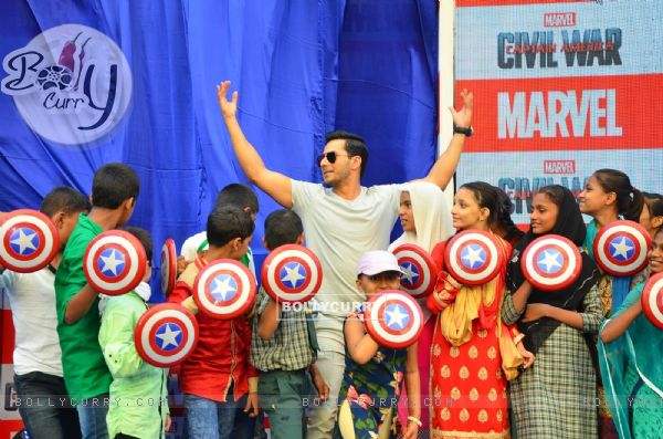 Varun Dhawan Poses with Children at Promotions of Marvel's Captain America