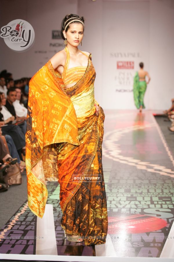 A model display the collection of Satya Paul at Lakme Fashion Week in Mumbai