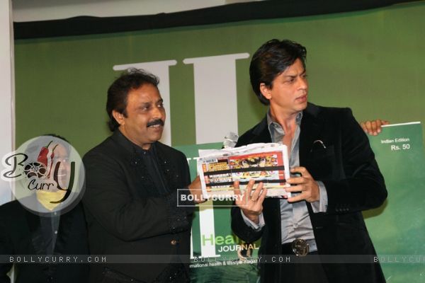 Shah Rukh Khan with Thumbey Moideen at the launch of a health magazine "Health International" in Mumbai on April8