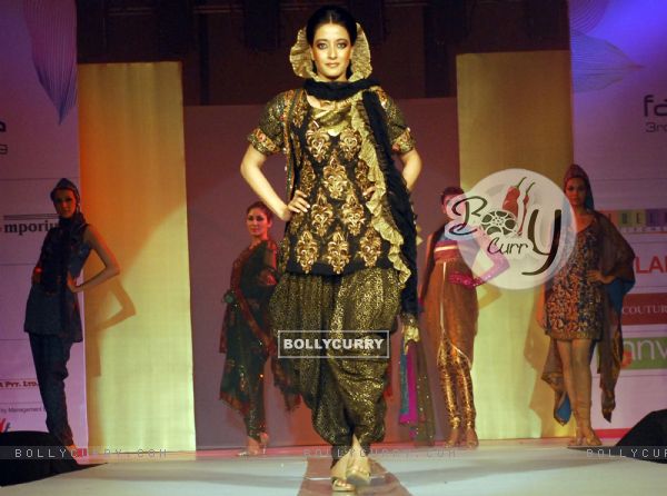 Glam siblings Riya Sen walking the ramp at COKUSS Kolkata Fashion File show on Tuesday Evening 4th Aug 09