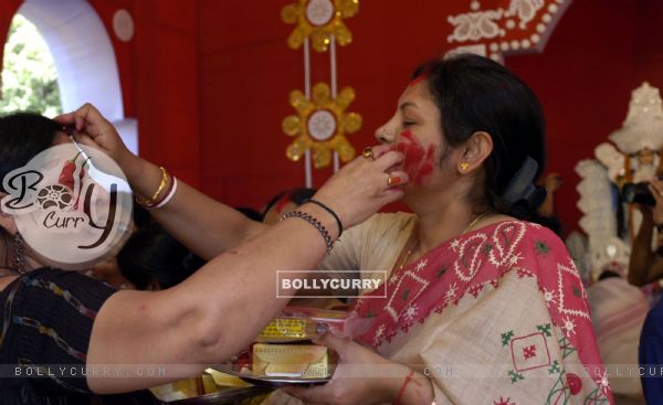 Ladies applying Vermilon after the end of Dasami at a puja pandal in East Delhi on Monday 28th September 2009 (Photo: Partha Sarkar, IANS)