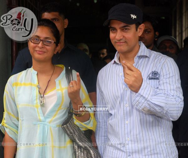 Aamir Khan & wife Kiran Rao pose after casting his votes today for Maharashtra Elections