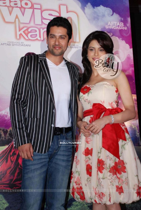 Bollywood Actor Aftab Shivdasani and Aamna Sharif pose for the photographers during the music release of forthcoming film ''Aao Wish Karein'' in Mumbai on Friday, 23 October 2009