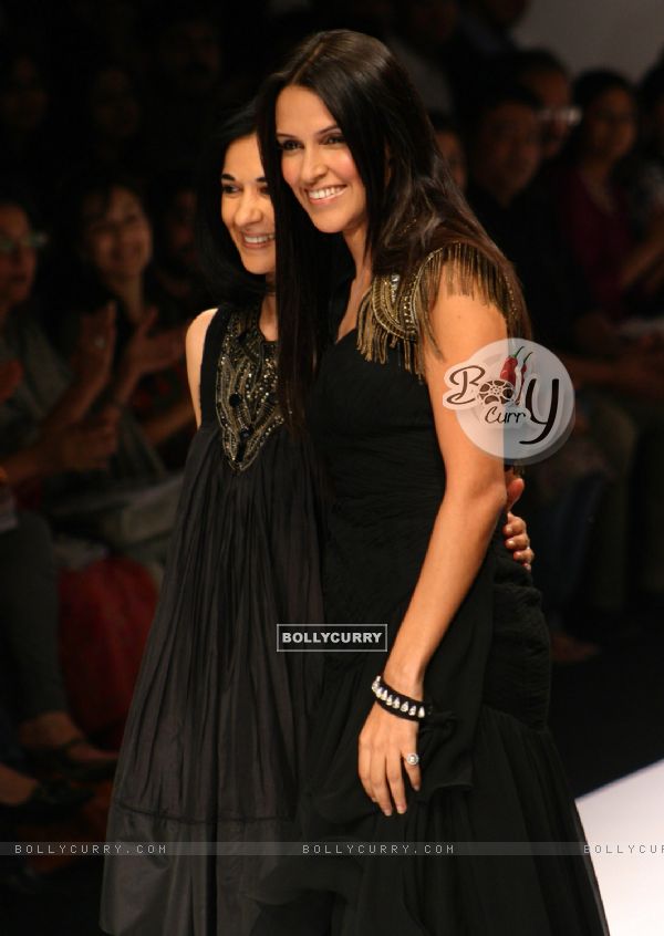 Bollywood actress Neha Dhupia and designer Kavita Bhartia at the Wills Lifestyle India Fashion week in New Delhi on Sunday