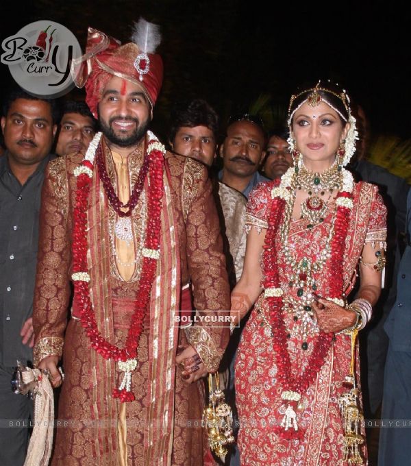 Bollywood Actress Shilpa Shetty and London based businessman Raj Kundra pose for the media after their marriage Ceremony in Khandala