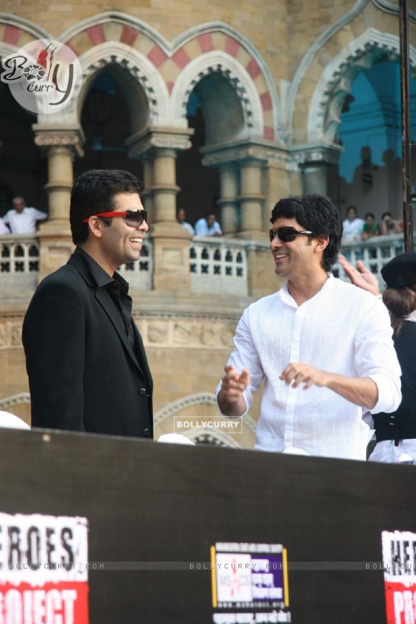 Bollywood actor-director Farhan Akhtar and Karan Johar pose for the photographers during the launch of new communication campaign ''HIV'' and ''Soul Cages''