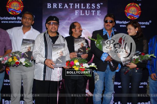Jazz Musician Louis Banks, Pandit Ronu Majumdar, Jackie Shroff and Yuvika Chaudhary pose for the photographers during their album launch of "Breathless Flute" in Mumbai