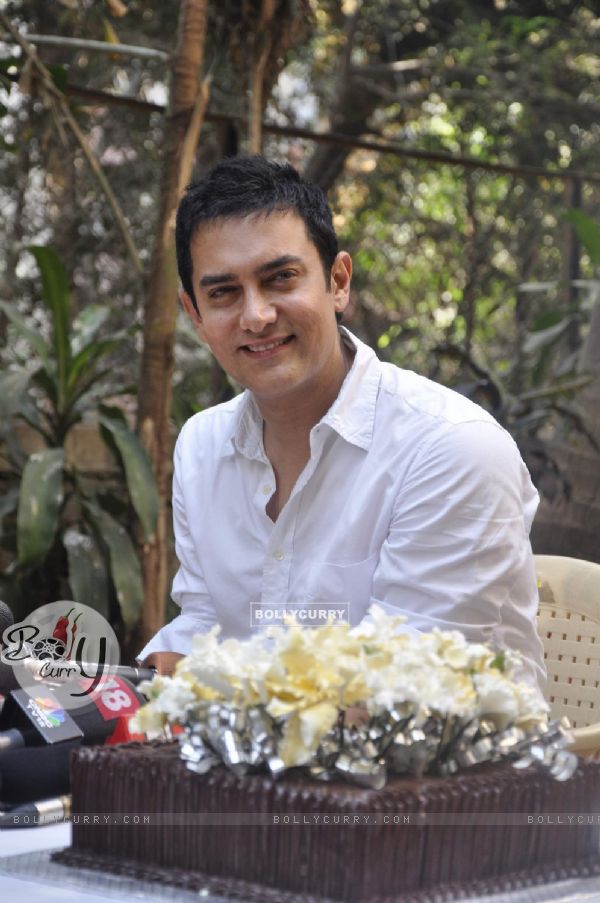 Aamir Khan smiles as he celebrates his 45rd birthday with media today at his home in Mumbai