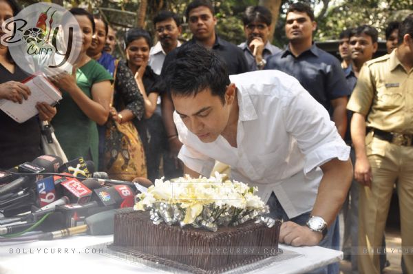 Aamir Khan blows his 45rd birthday candles as he celebrates his 45rd birthday with media today at his home in Mumbai