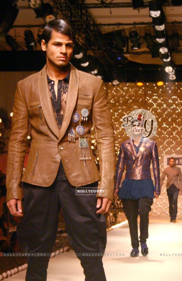A model showcasing designer Rohit Bal''s creation at the Ven Heusen India Mens Week, in New Delhi